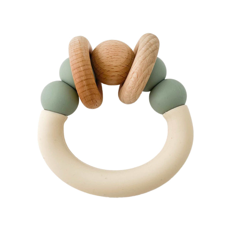 Pretty Please teethers eucalyptus orbit teething ring against white backdrop