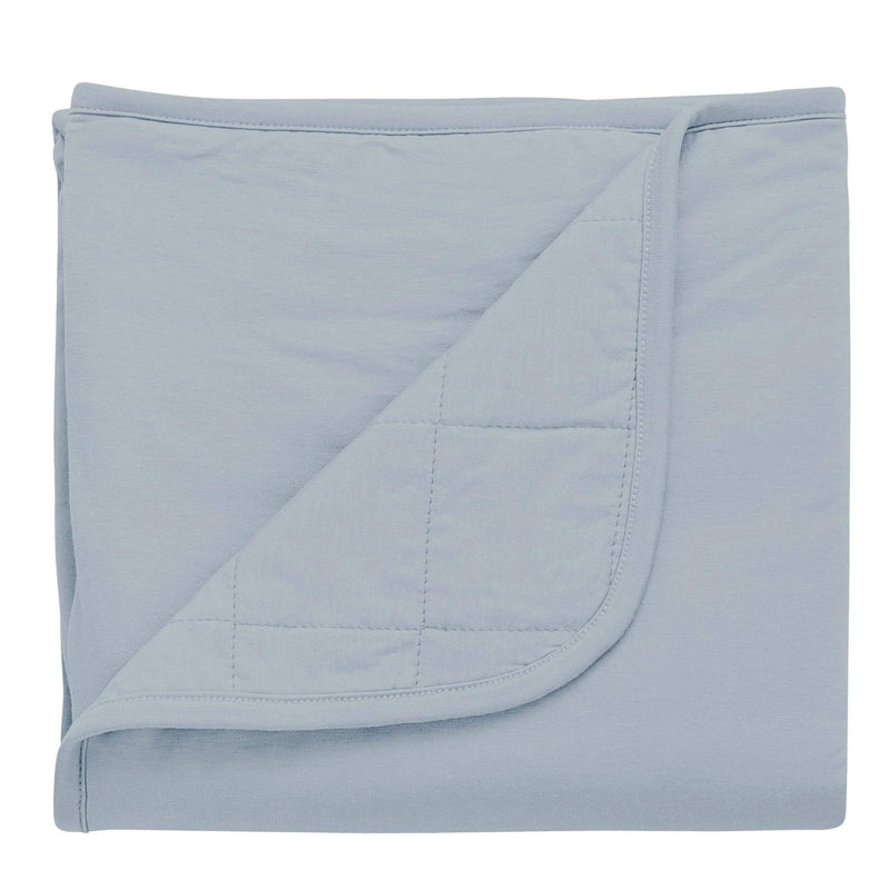 Kyte Baby fog baby blanket against white backdrop