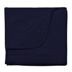 Kyte Baby navy baby blanket against white backdrop