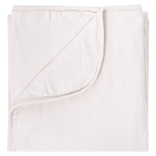 Kyte Baby oat baby blanket against white backdrop