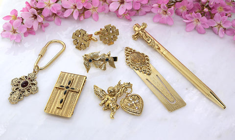 Gold-toned religious jewelry featuring crosses and angels