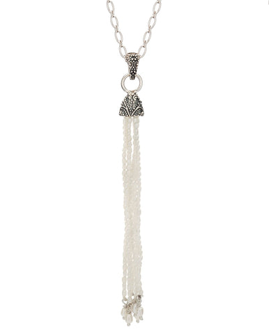 sterling silver pendant featuring a delicate bead tassel hanging from granulation detailing on a hinged bail