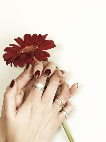 hand with sterling silver rings 