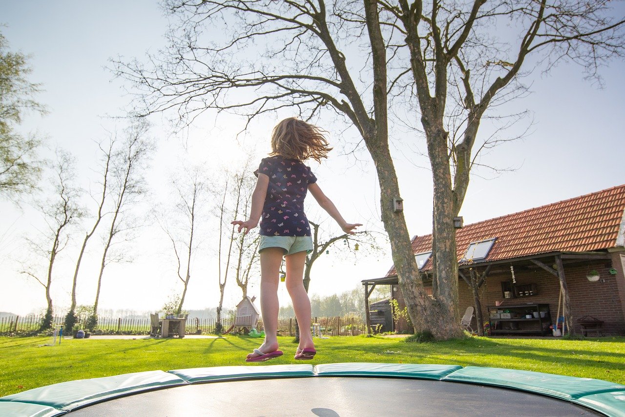 Girl jumping in trampoline