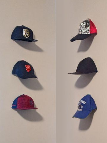 Baseball Cap Collection - Traci Farden.  Cap Capers make caps look like they are floating on wall.