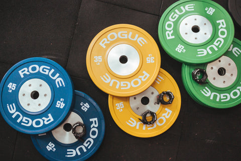 Some colorful weights on the ground.
