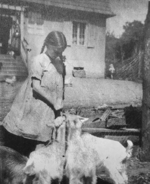 Gisela von Davidson on childhood farm with goats
