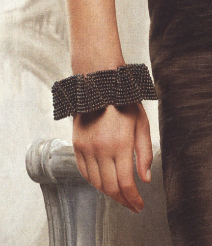 Detail of black pearl cuff bracelet, The Knot magazine