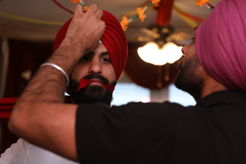 Securing the turban with a pin