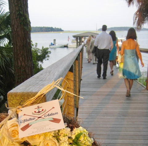 Wedding Guests walking down dock to Lady Grace Reception at Palmetto Bluff
