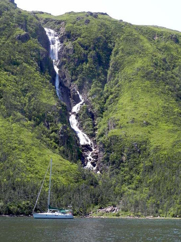 waterfall fjord sailboat adventure