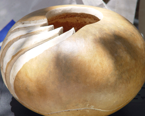 Thick canteen gourd, partially carved