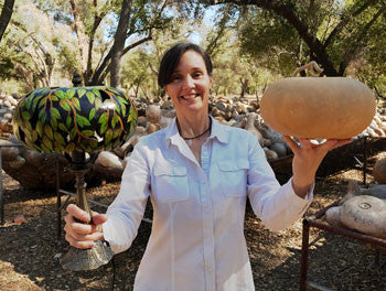 Phoebe Welburn Holds a Canteen Gourd and Gourd Lamp