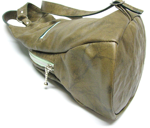 leather backpack, sling bag, knapsack showing oval bottom
