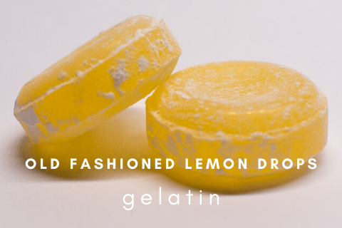 Two old fashioned lemon drops on a white background with the words old fashioned lemon drops gelatin