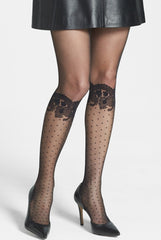 Woman's legs showing Alida black sheer tights with spotty mock knee highs with floral lace border at knee cap.