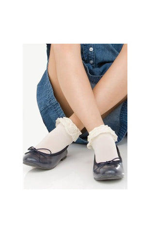 Girls legs crossed at the ankle wearing white frilly socks and black ballerina flats.