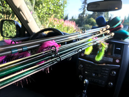 Fly rods and reels loaded in car.