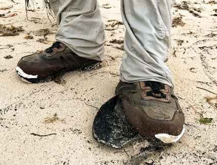 Wading boots with loose soles.