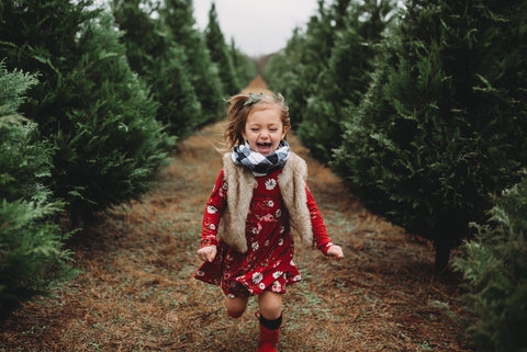 toddler-red-dress-running-outside-christmas-farm