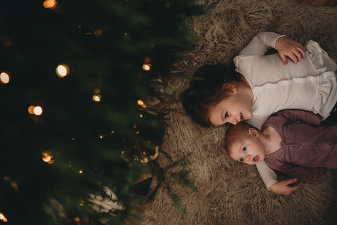 sisters under christmas tree easy diy photo shoot ideas from white loft home blog 