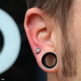 Earlobe piercing by John