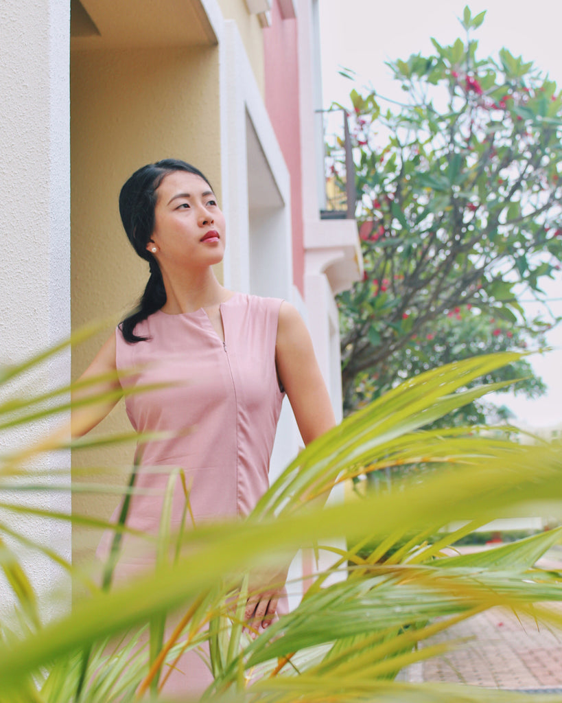 Elisa posing in Sleeveless Midi Dress in Dusty Pink