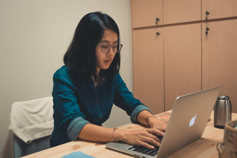 Elisa working on her laptop