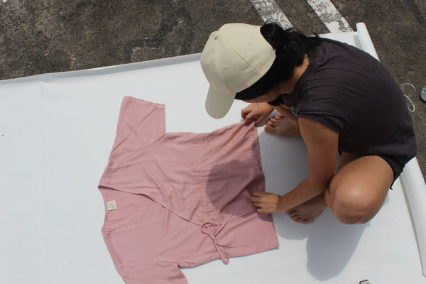 Elisa arranging Kimono Drawstring Blouse for a photoshoot