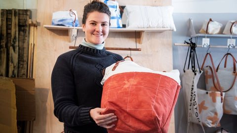 Korina Brewer in her studio in Kingston, NY surrounded by recycled sailcloth and leather bags.