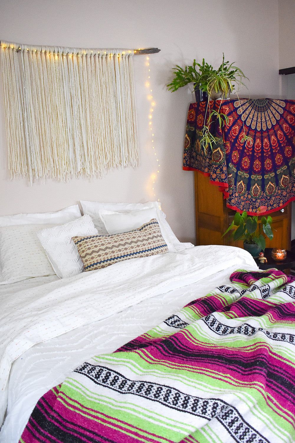 Get cozy in the bedroom with the Neon Candy Bohemian Fiesta Blanket for a Boho Hygge look.
