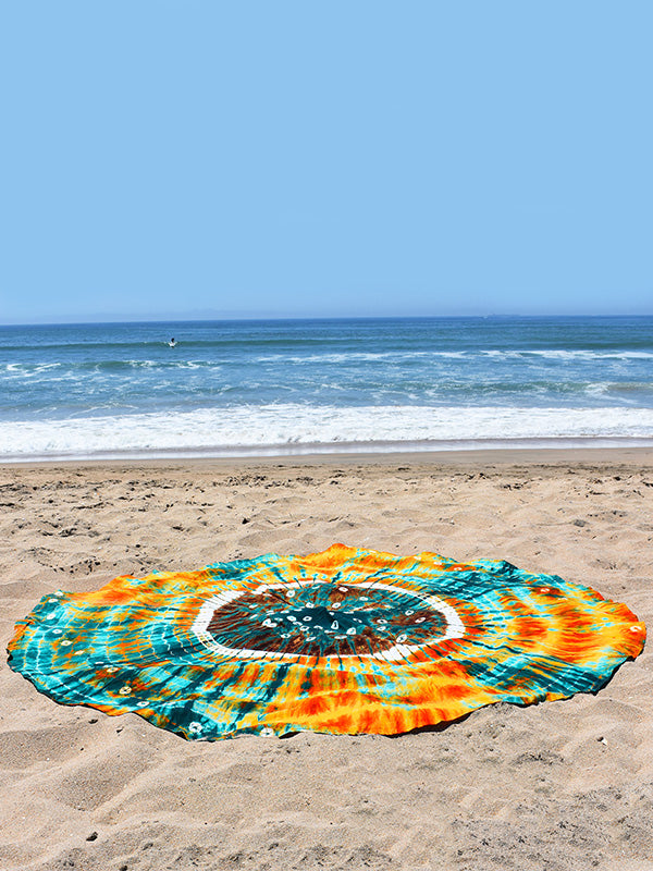 Take your roundie to the beach to use as a beach blanket. With plenty of room for you and even a friend, you’ll be able to lay out, relax, and enjoy the sunshine in comfort from your very own circular beach throw blanket. The lightweight, cotton fabric dries quickly so you can pack it up and take with you wherever you go.