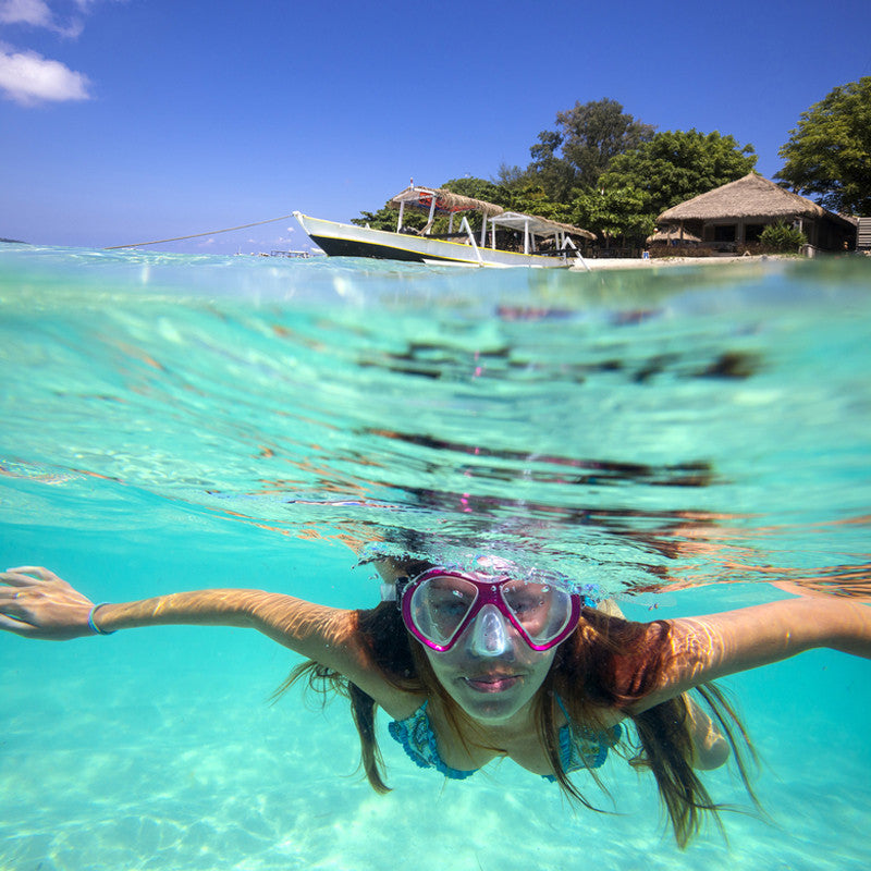 woman swimming half under water