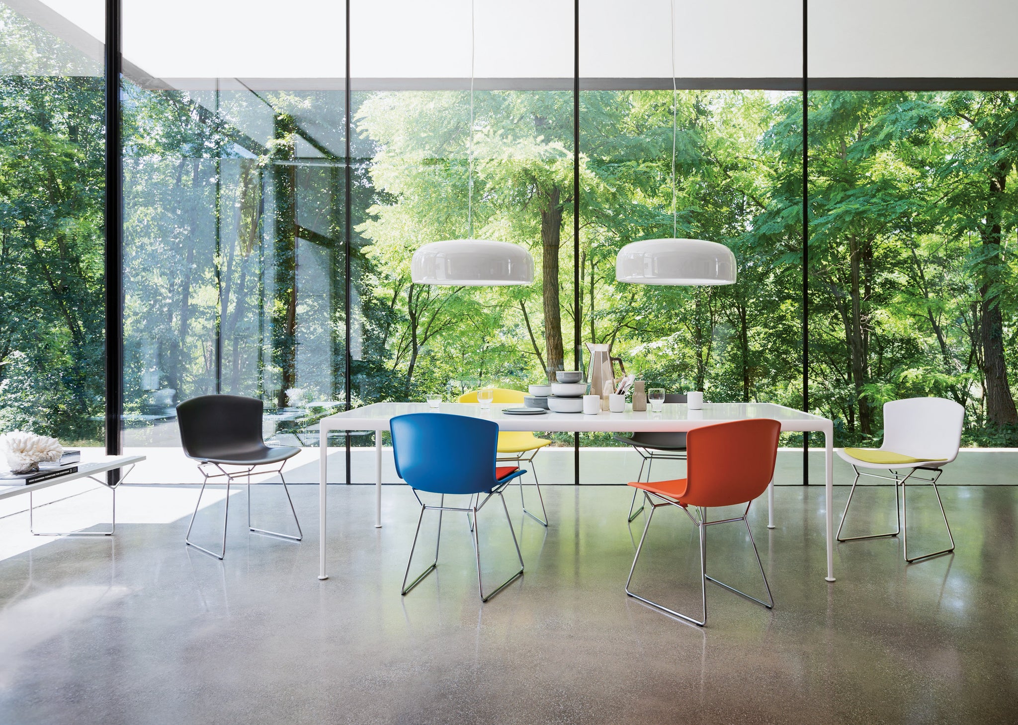 Colorful Knoll Chairs Around a White Kitchen Table 