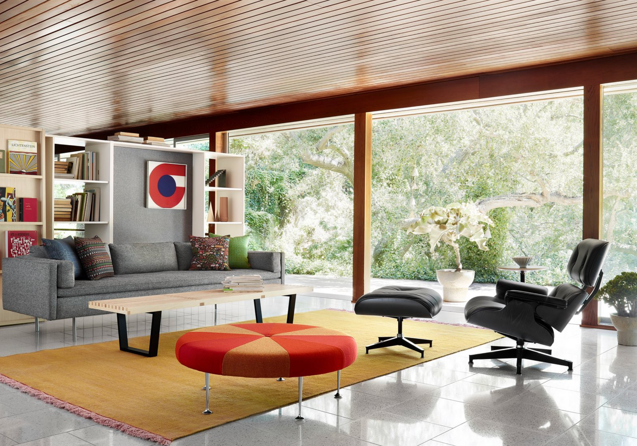 Herman Miller Chair, Couch and Ottoman in a Living Room Settign with Large Window