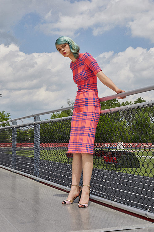 Cynthia Rowley Resort 2019 Collection featuring a blue and sorbet colored plaid dress paired with gold and blush colored heels. 