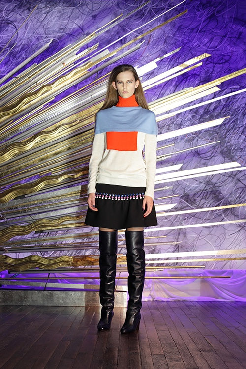 Cynthia Rowley Fall 2014 look 8 featuring a white sky blue and orange long sleeve turtle neck color-blocked sweater and a black mini skirt with navy pink and white polka dot embellishments
