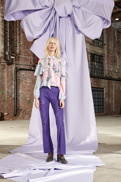 Cynthia Rowley Fall 2017 Look 10 featuring a blouse with ruffle and neck tie in chiffon with kitten print and purple cropped cargo flares in bonded suede