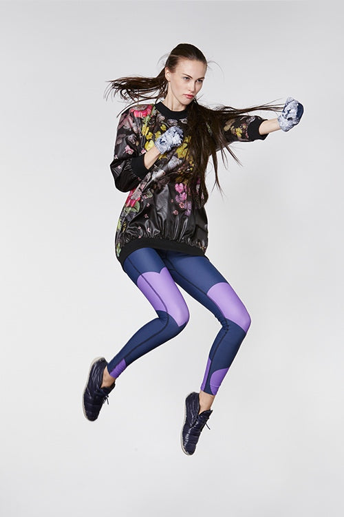 Cynthia Rowley Fall Fitness 2015 look 16 featuring purple and blue leggings with oversize heart print and dark floral nylon sweatshirt