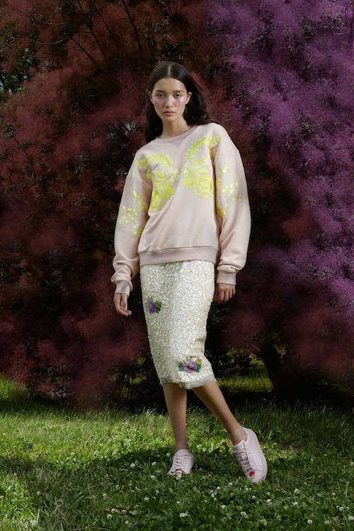 Cynthia Rowley Resort 2018 Look 6 featuring a sequin skirt and light pink sweatshirt with embroidery