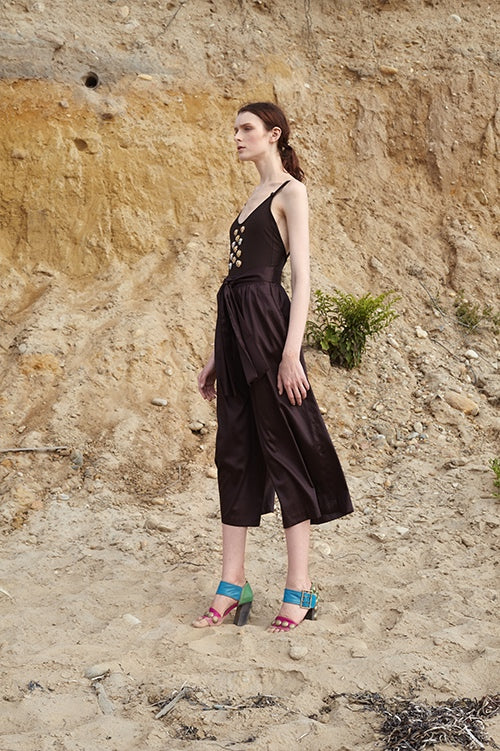 Cynthia Rowley Spring 2016 look 13 featuring brown one piece swimsuit with front embellishments worn under brown polished cotton wide leg cropped pants with waist tie