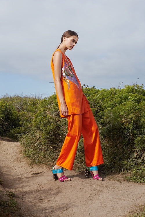 Cynthia Rowley Spring 2016 look 18 featuring orange polished cotton wide leg pants and tunic with sequin embellishments 