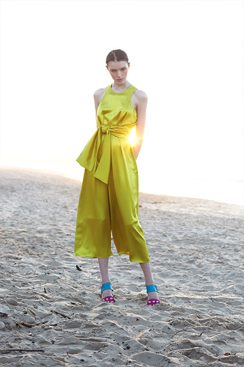 Cynthia Rowley Spring 2016 look 6 featuring a chartreuse silk satin jumpsuit with waist tie