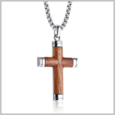 Wooden silver crucifix cross pendant hanging from a silver chain