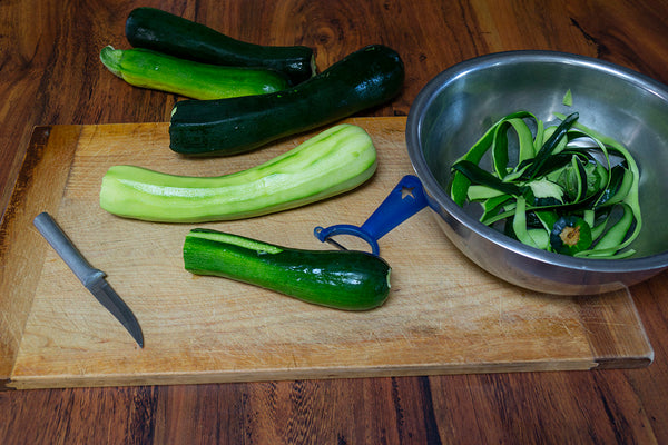 Peeling zucchini for zucchini pizza