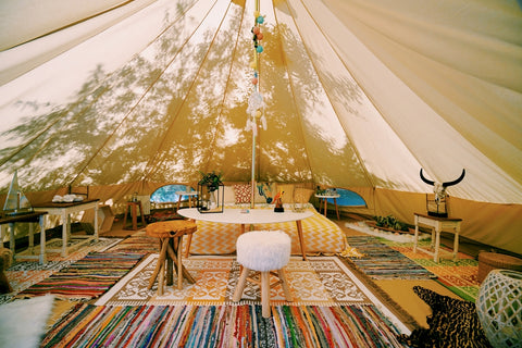 Tent with rugs and chairs 