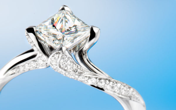Princess diamond and small briliant cut diamonds, in "Countess" engagement ring