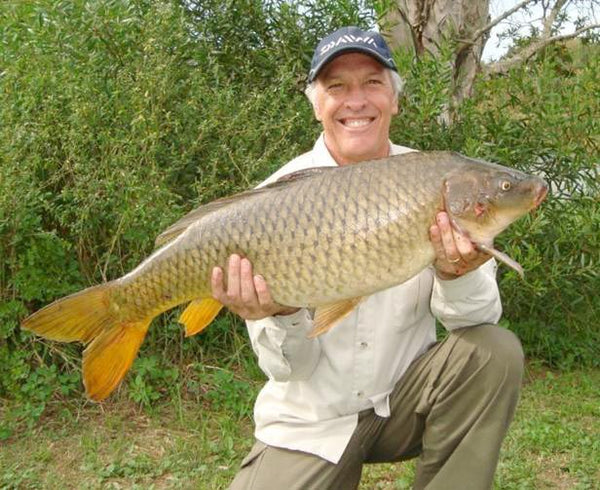 Andy with a 9.5 Kilogram carp caught off the bank in Australia