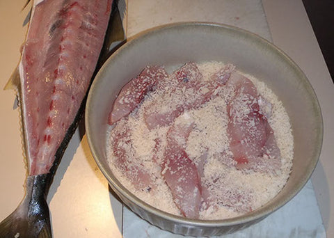 Place the fish in a bowl and mix with panko breadcrumbs