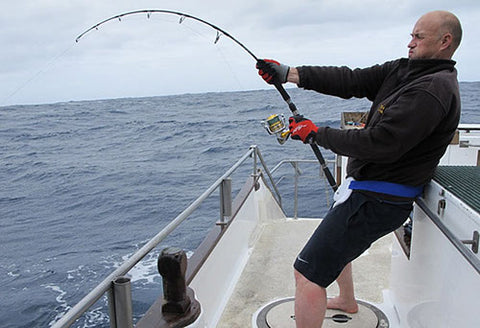 Herb catching Kingfish using assist hooks